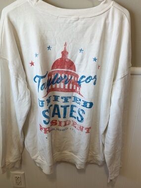 Taylor Swift Lovers! White Graphic Sweatshirt with Red & Blue Capitol Design